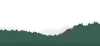 Mountain range with mist around it and a village on its side